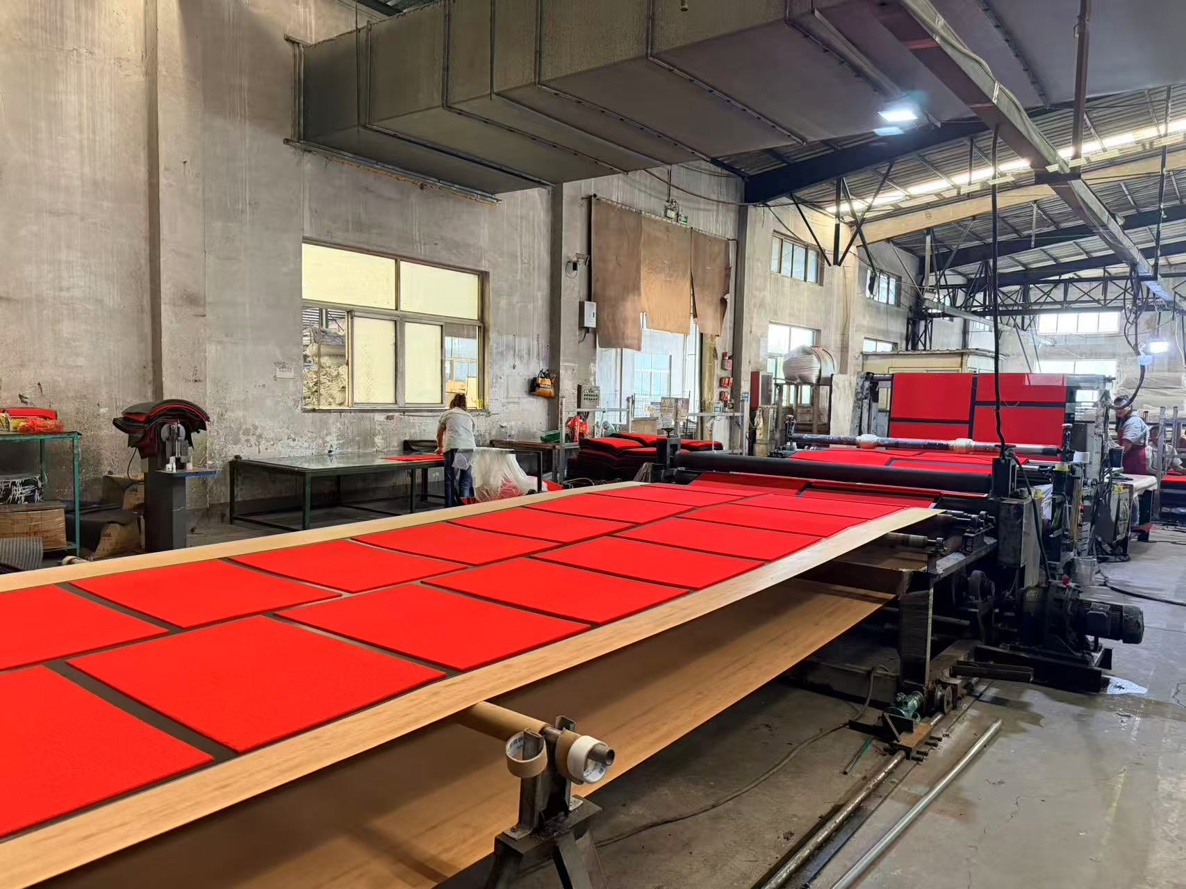 Red and black floor mat production line